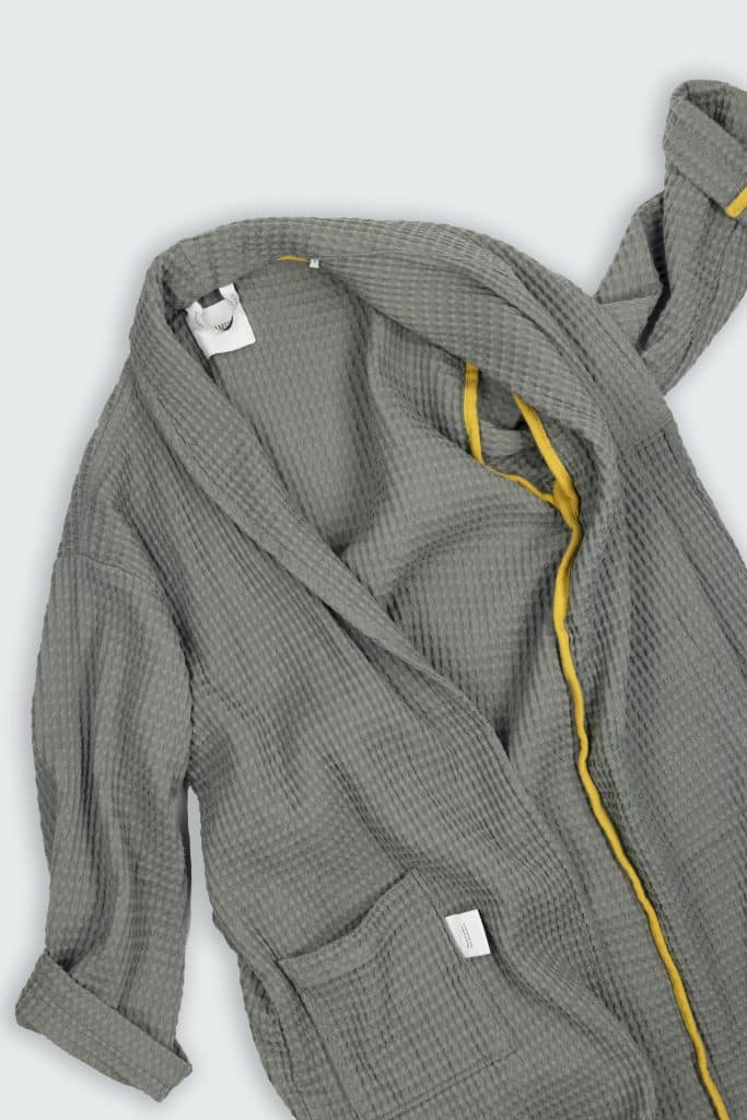 Caracalla bathrobe laying on the ground