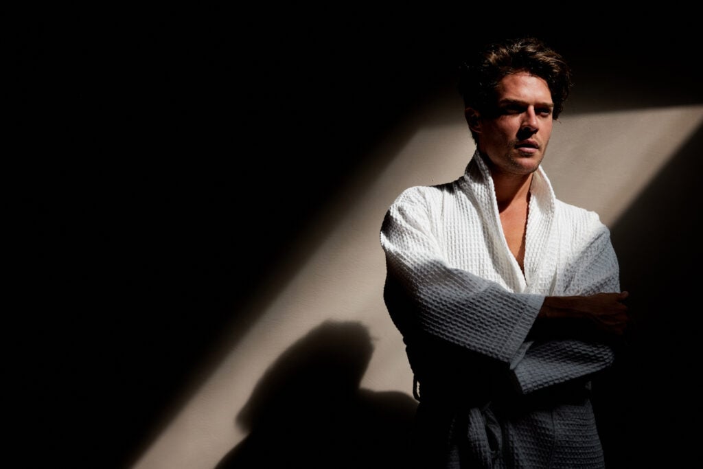 Cesar Casier wearing the NIMU Caracalla waffle bathrobe in white